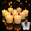 A collection of glowing white tea lights arranged on a dark surface with a remote control visible.