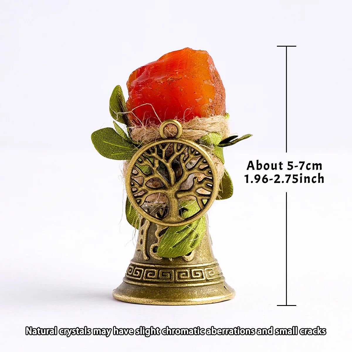 A natural crystal brass bell with a copper finish and green leaves.