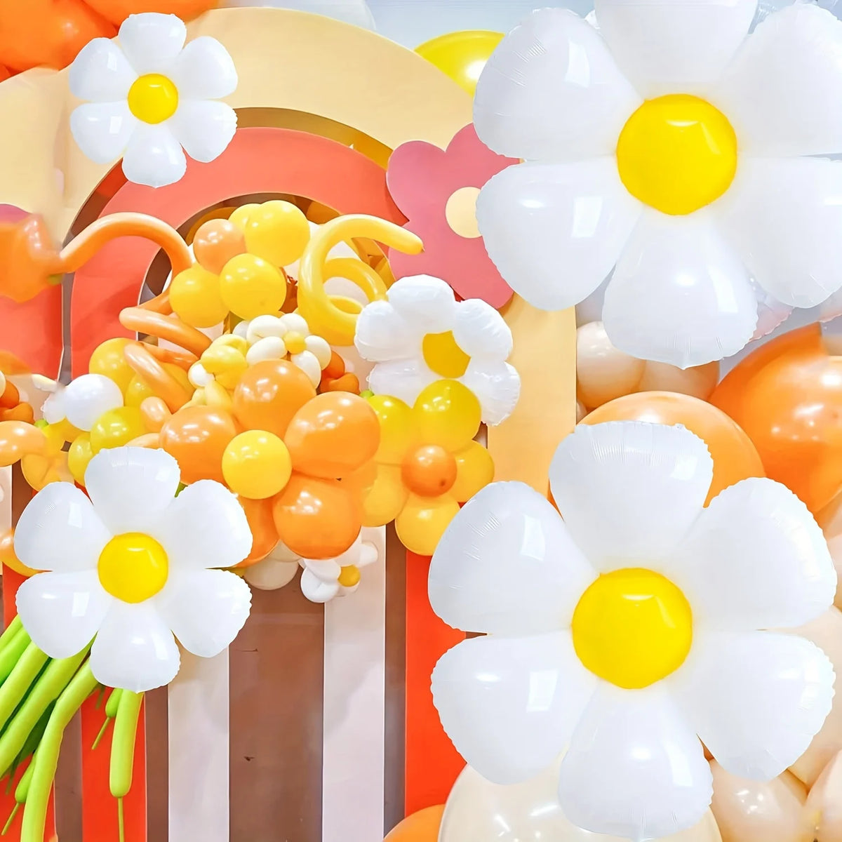 A close-up of elegant white and yellow daisy-shaped balloons arranged in a colorful display.