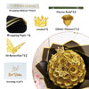 A golden artificial rose bouquet with glitter flowers and a crown, presented in a dark box.