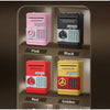 A display of four interactive roll-up piggy banks in pink, black, red, and golden colors.