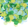 A pile of round tissue paper confetti dots in shades of green and yellow-green.