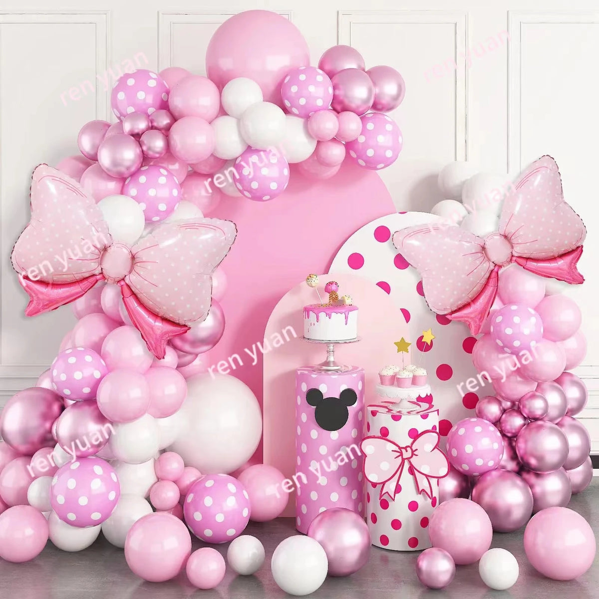 Pink and white balloon wreath archway set featuring pink and white balloons and bow accents for parties