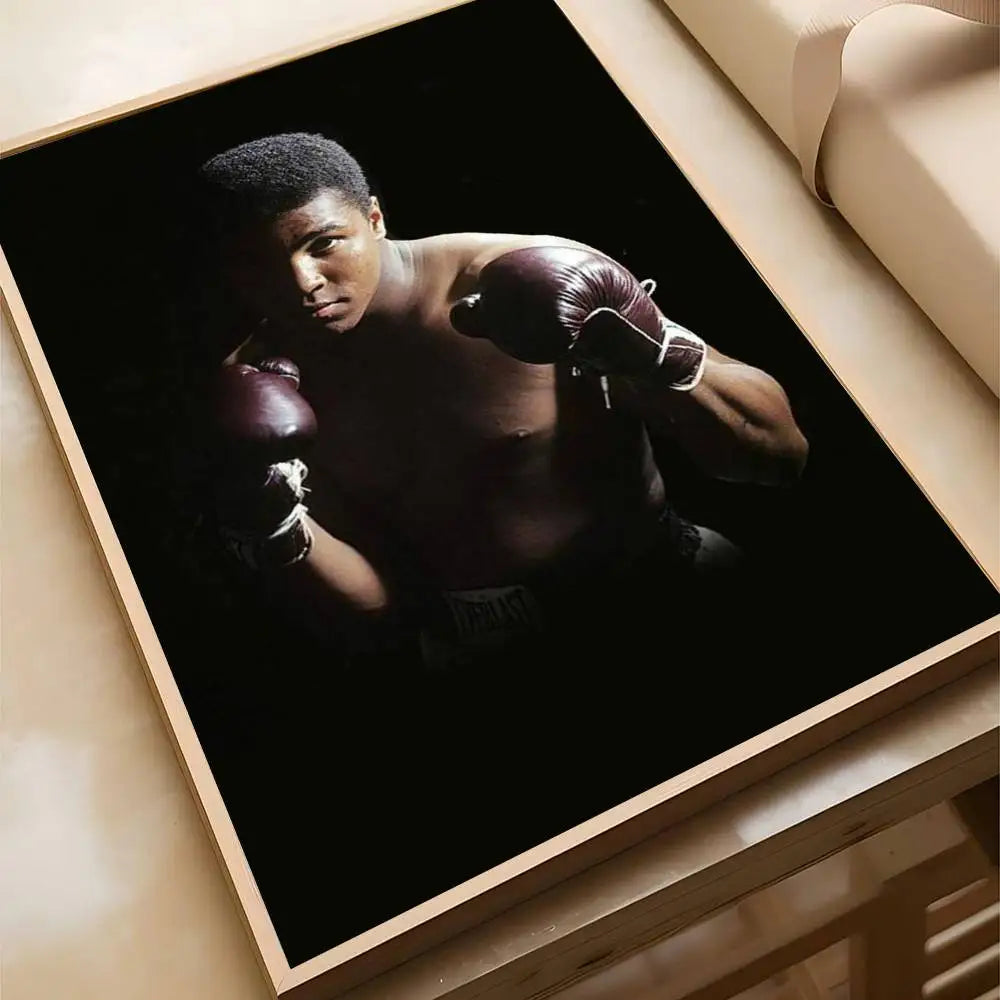 A portrait of a boxer in boxing gloves against a dark background, displayed in a framed poster.