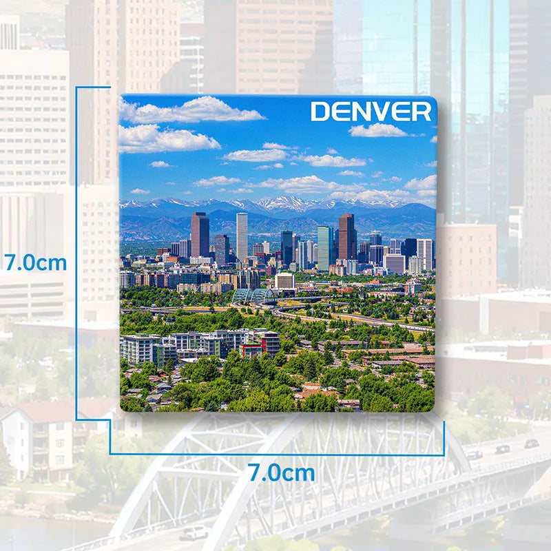 A magnet featuring a scenic view of Denver city skyline and mountains.