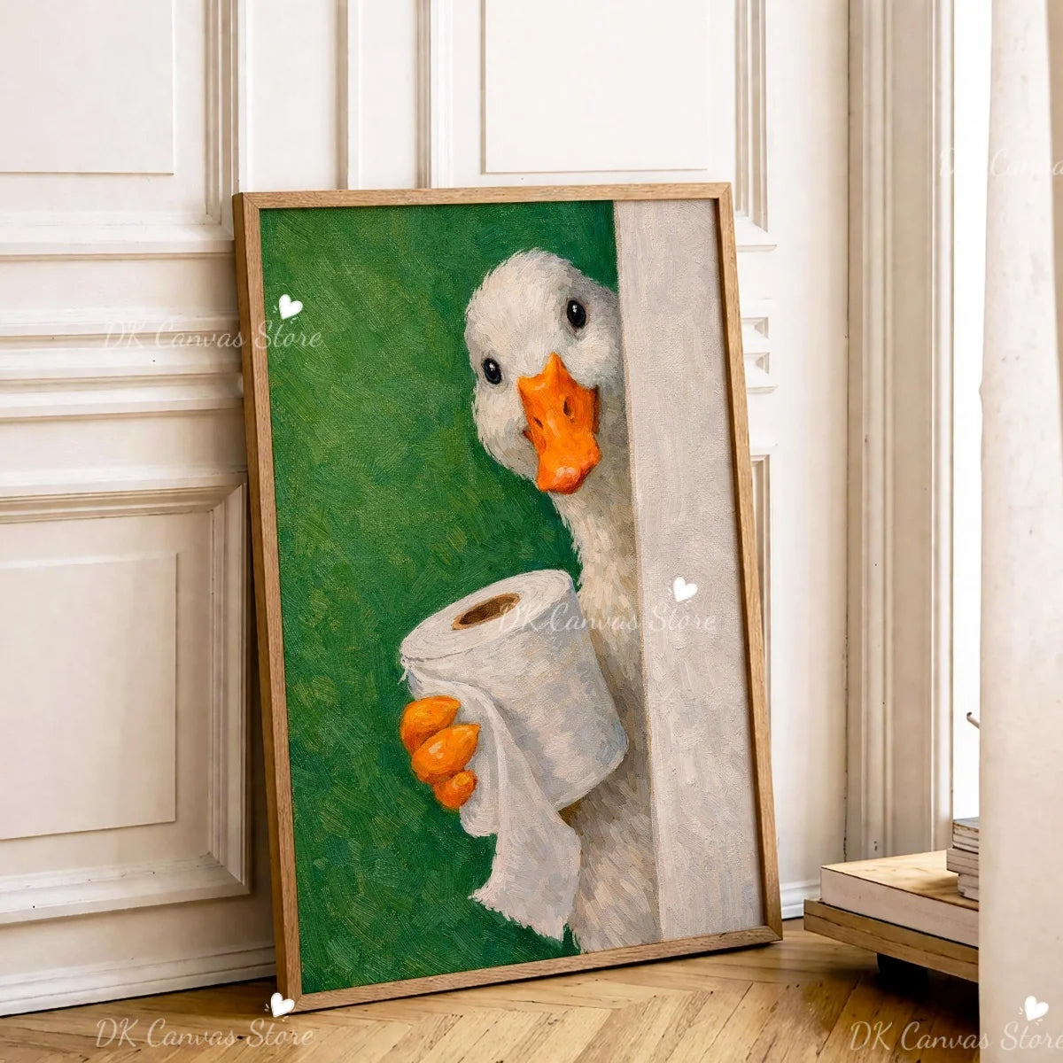A framed canvas print of a white duck with an orange beak and a white cloth, set against a green background.