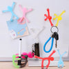 A collection of colorful flexible mini figures and magnets displayed against a white background.