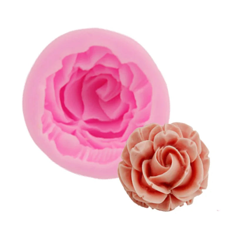 Pink silicone mold shaped like a rose flower for cake decorating