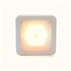 A square LED night light with a translucent yellow glow housed in a white frame.