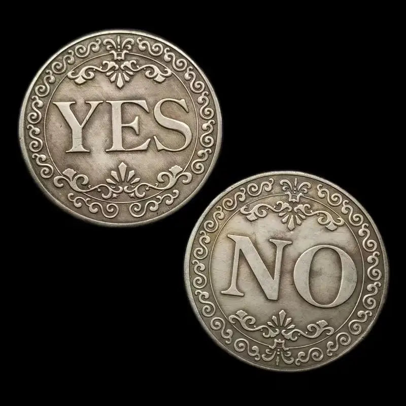Antique silver-gray decision coin showing the word YES on one side and NO on the other