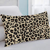 A decorative pillow cover featuring a black and brown leopard print on a cream background.