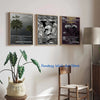 Three framed canvas art prints featuring abstract music album covers displayed on a white wall.