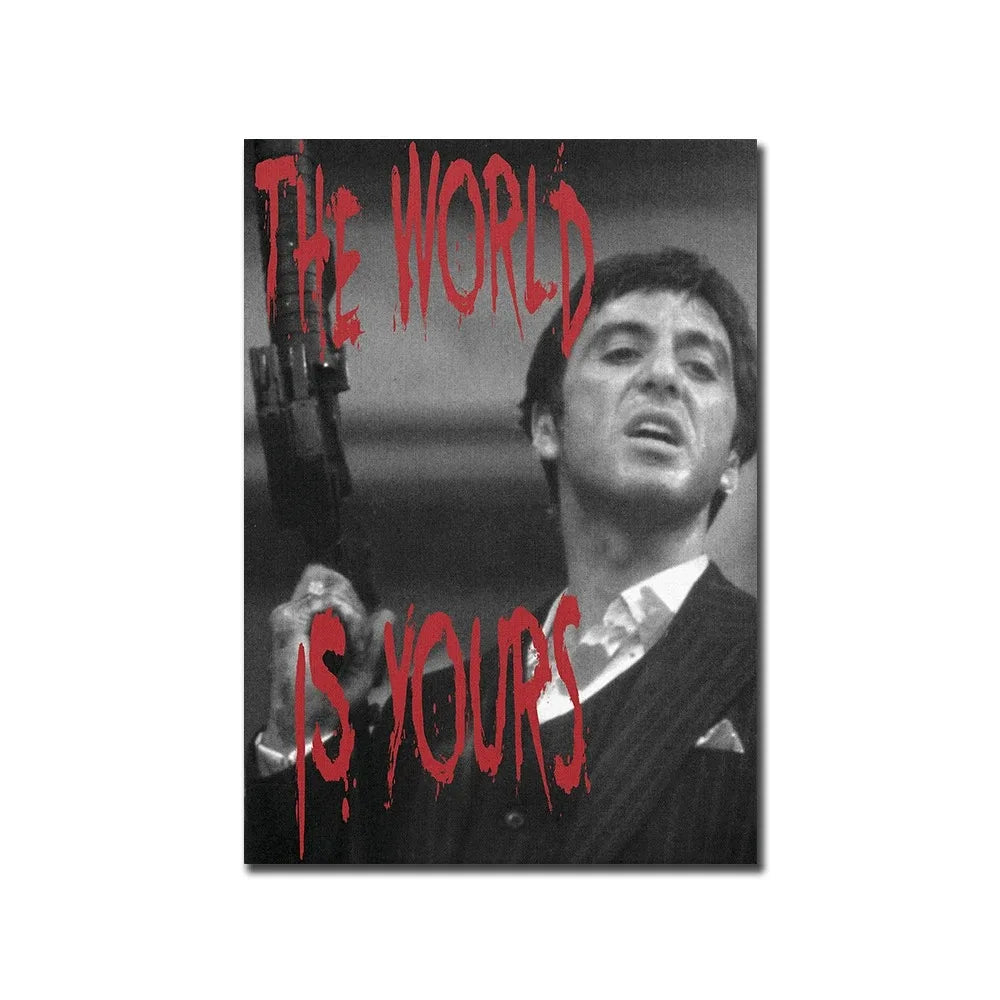 Wall art featuring a man looking up with red text that reads The World Is Yours