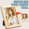 A wooden photo frame displaying a portrait of a woman wearing a straw hat, with text suggesting customization for a photo wal