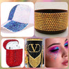 A collection of rhinestone accessories including a baseball cap, a gold bracelet, a red storage basket, and an eye makeup loo