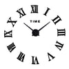 A black analog wall clock face with Roman numerals and a black hand pointing near the twelve mark.