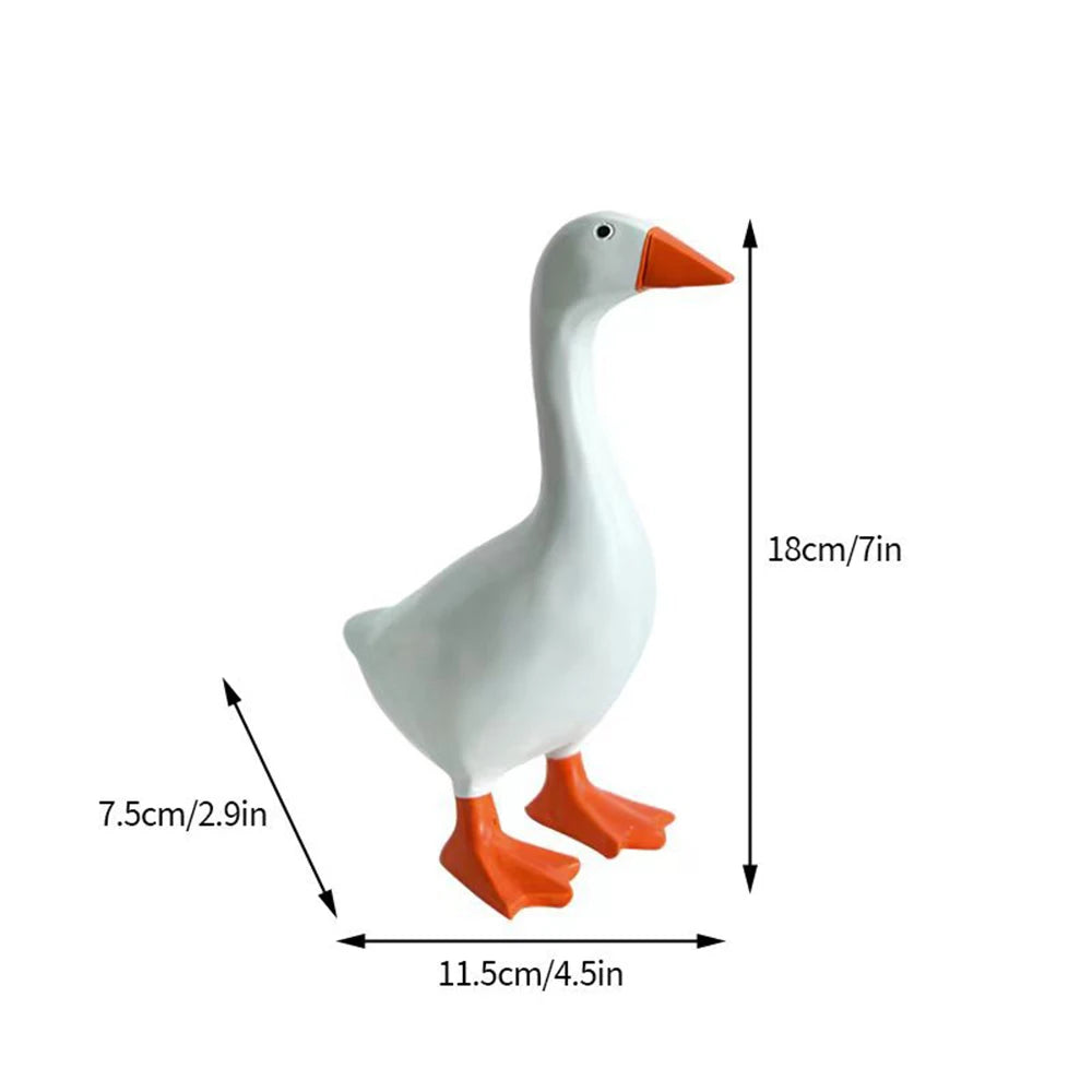 White magnetic goose key holder with orange beak and feet, shown in a side view.
