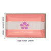 Pink and white striped lapel pin featuring a purple flower design.