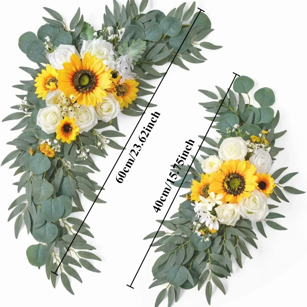 A floral kit featuring yellow and white flowers and dusty rose eucalyptus greenery for a wedding arch decoration.
