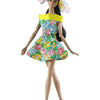 A handmade doll dress gown featuring a floral print and a yellow collar, worn by a fashion doll.