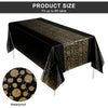 Black tablecloth with gold polka dots, waterproof fabric, displayed on a table.