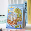 A blue spiral-bound book titled Material Book featuring a Kawaii Miniature Scene Sticker Book for kids