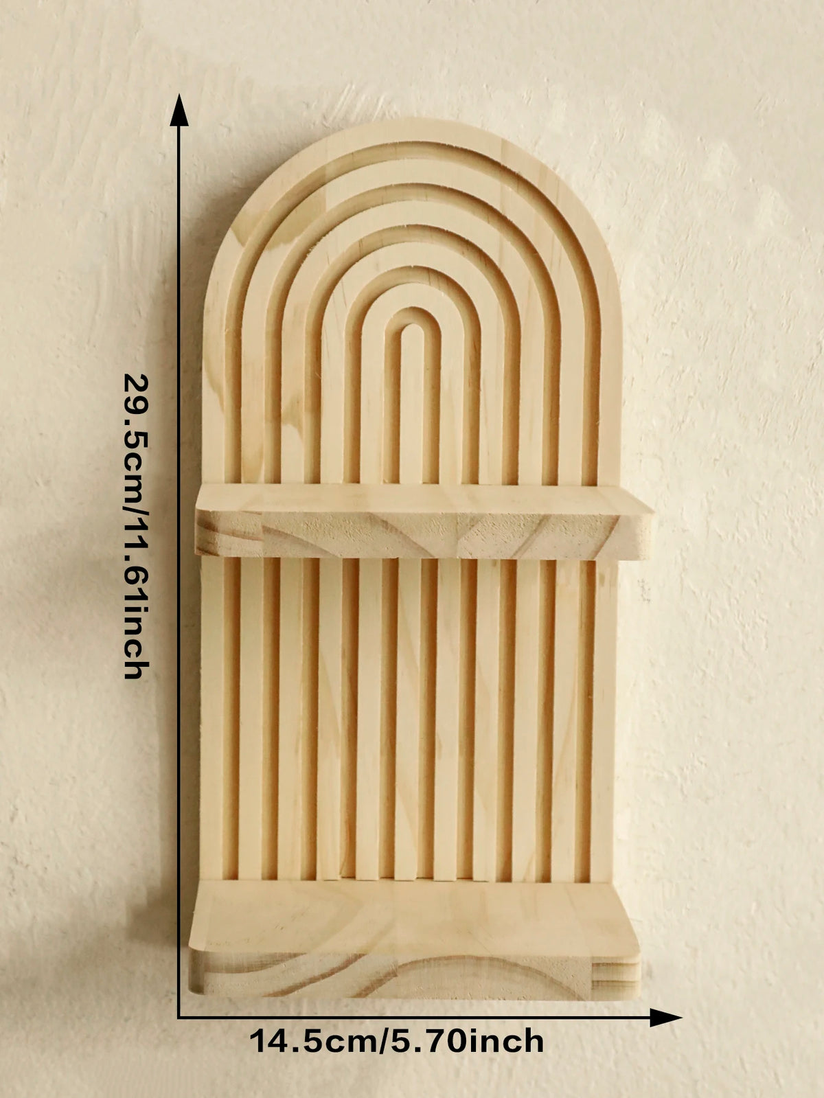 A wooden geometric wall shelf with a curved, ribbed design mounted on a wall.