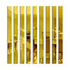 A row of vertical acrylic mirror strips in gold color used as wall decor.