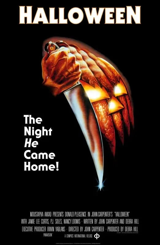 Poster for The Night He Came Home featuring a menacing mask and Halloween text