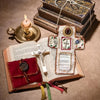 Handmade prayer quilt featuring a silver cross pocket shrine and decorative elements on an open book.