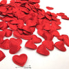 A pile of 200 red fabric heart throwing petals for weddings and parties.