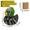 A dark gray resin figurine of a duck with green feathers and a yellow beak, packaged for spooky decor.