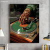 A close-up of a hand placing a vinyl record onto a turntable, set against a dark background.