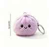 A soft lavender plush butter dumpling squishy keychain with a smiling face and silver chain.