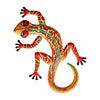 Handcrafted metal gecko wall art featuring vibrant orange, red, and yellow scales.