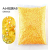 Bag of orange resin rhinestones for crafting