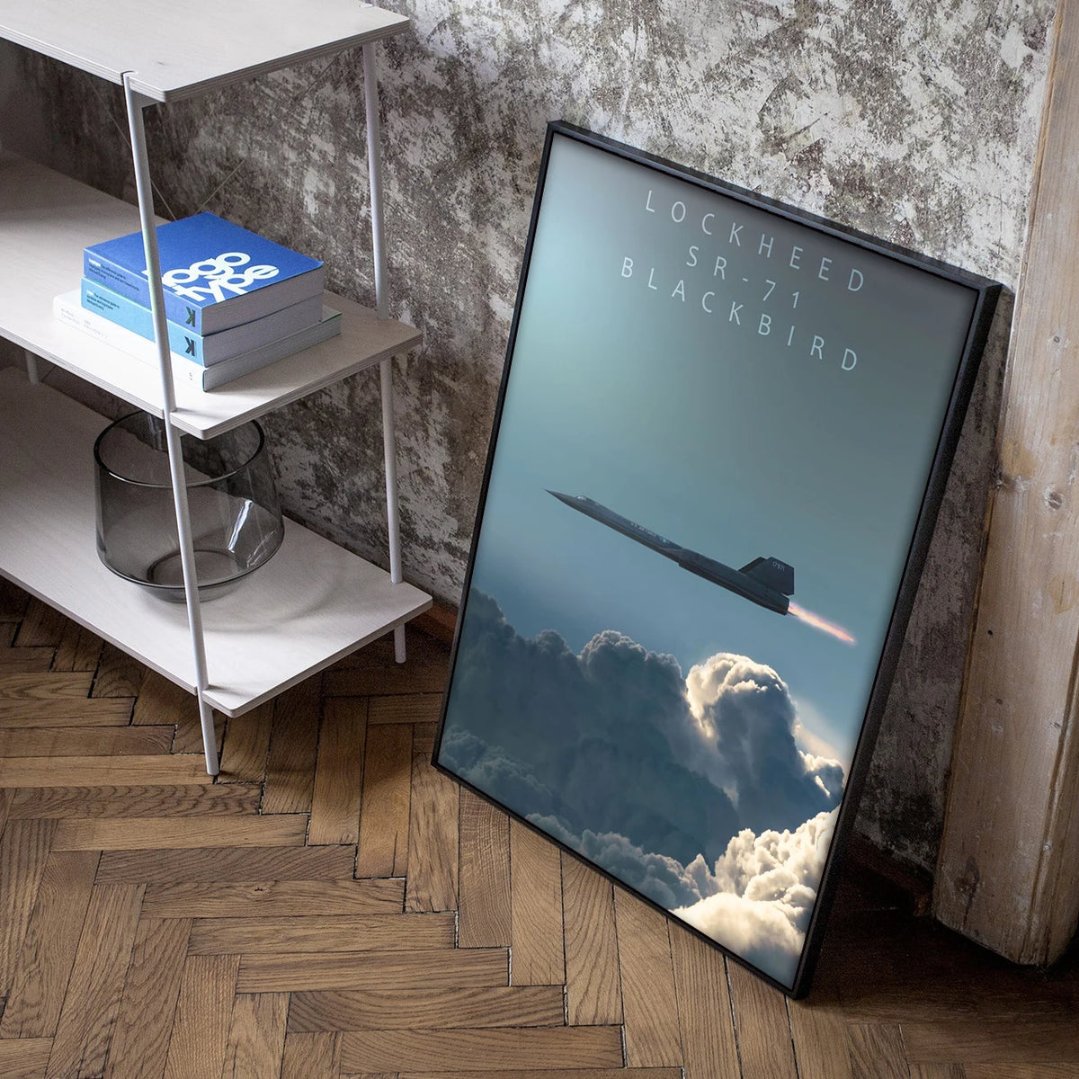 A framed canvas wall art poster depicting a Lockheed SR-71 Blackbird jet flying above clouds.