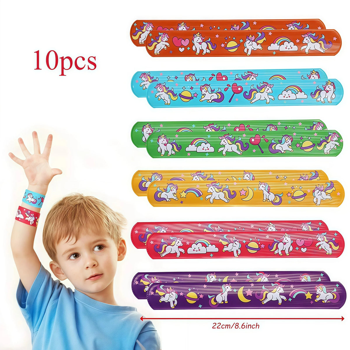 A young boy holds a colorful set of unicorn themed party supplies featuring various stickers and decorations.