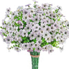 A bouquet of white and purple artificial flowers resembling eucalyptus and violets.