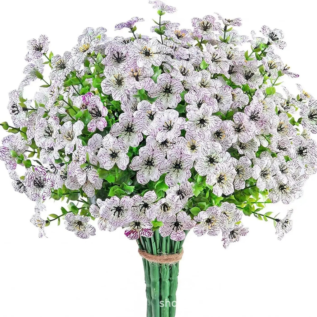 A bouquet of white and purple artificial flowers resembling eucalyptus and violets.