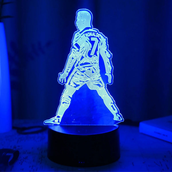 A glowing blue silhouette of a football player wearing number 7 stands on a black base.