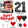 A set of red and black birthday balloons including a 32-inch number balloon and heart shaped balloons.