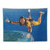 A smiling person in a yellow shirt is shown jumping with a thumbs-up gesture above the Earth from a blue background.