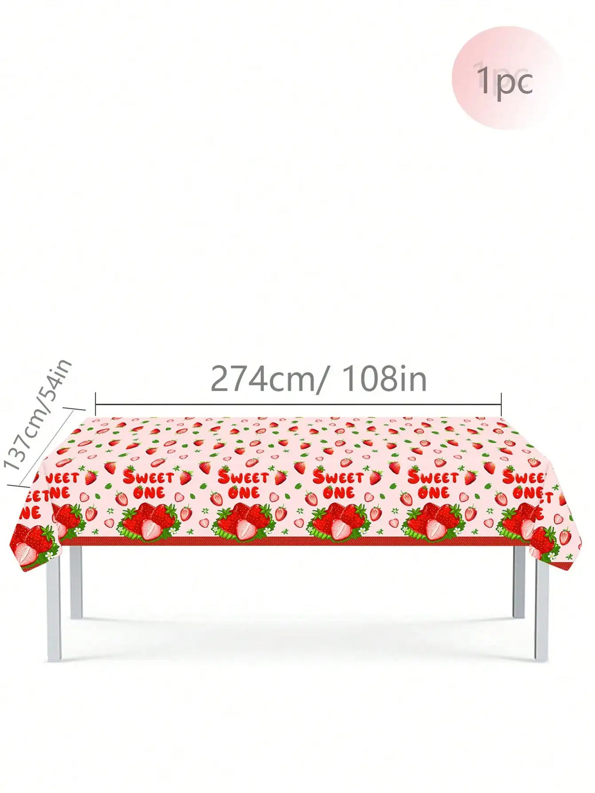A long red table covered with a strawberry pattern, featuring disposable tableware for a birthday party.