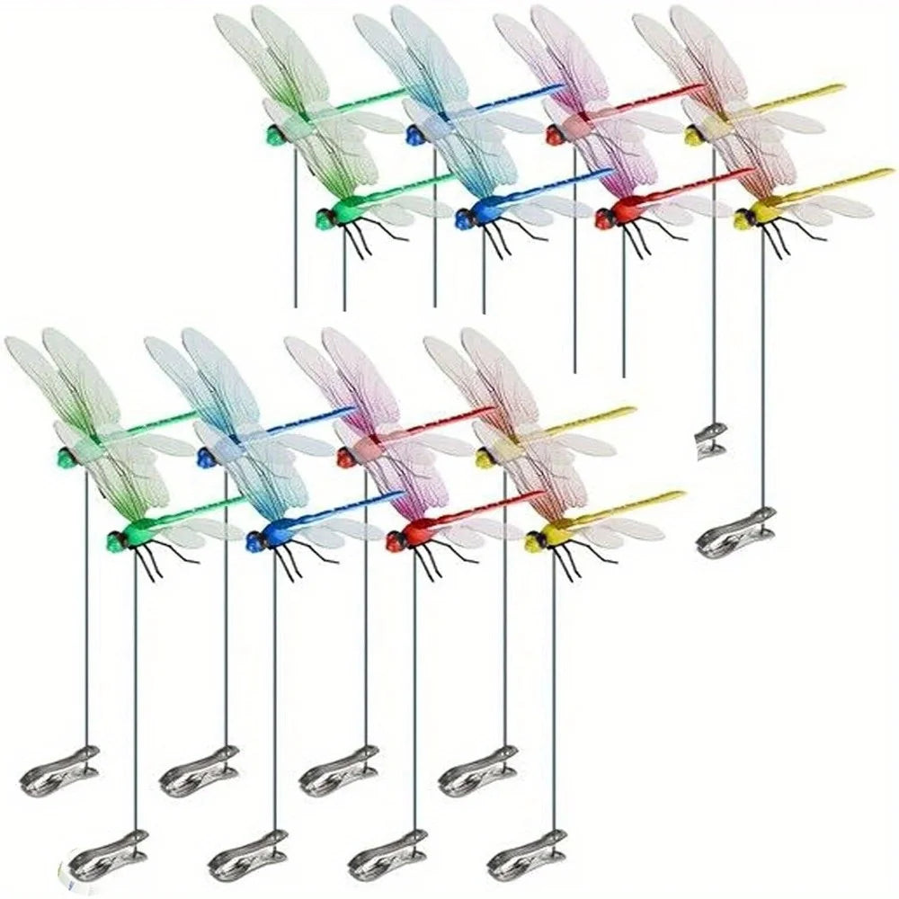 A collection of realistic dragonfly hat clips in various colors hanging from strings.