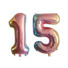 Silver foil number balloons shaped like 15 for a birthday party
