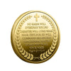 A round gold-plated collectible coin featuring a cross and text about protection.
