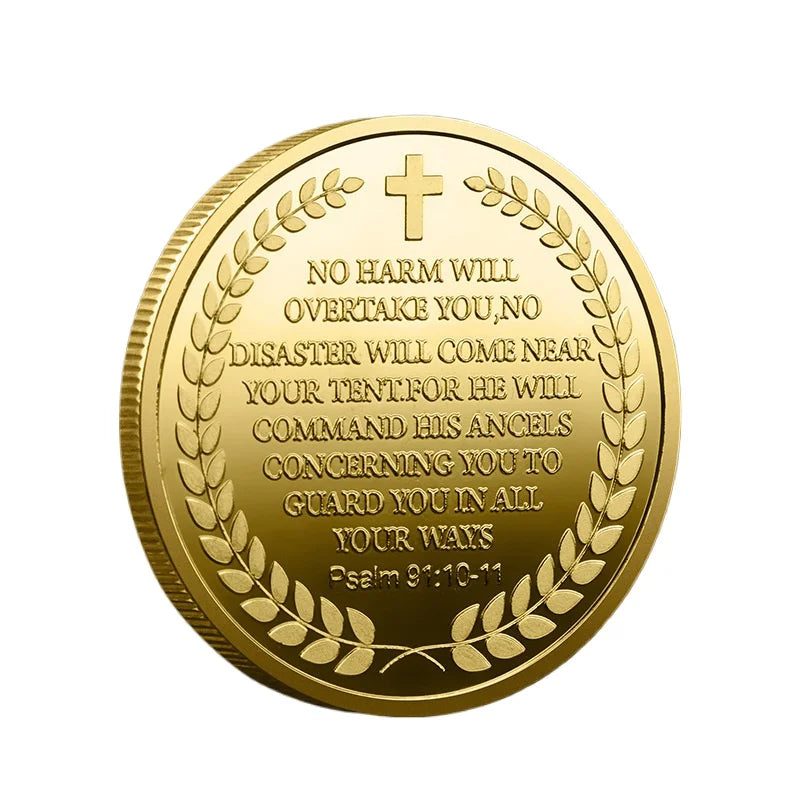 A round gold-plated collectible coin featuring a cross and text about protection.