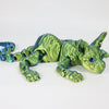 A realistic green Sphynx cat fidget toy with textured skin and blue accents.