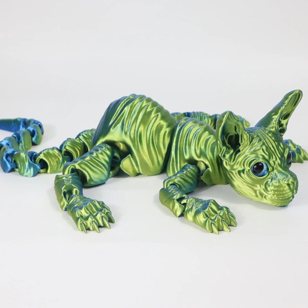 A realistic green Sphynx cat fidget toy with textured skin and blue accents.